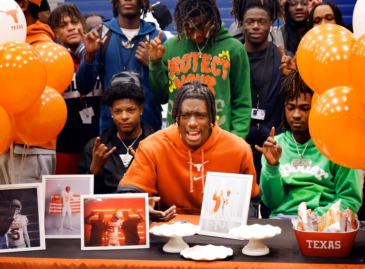 While posing for photos, Sachse wide receiver Kaliq Lockett reacts after realizing someone...