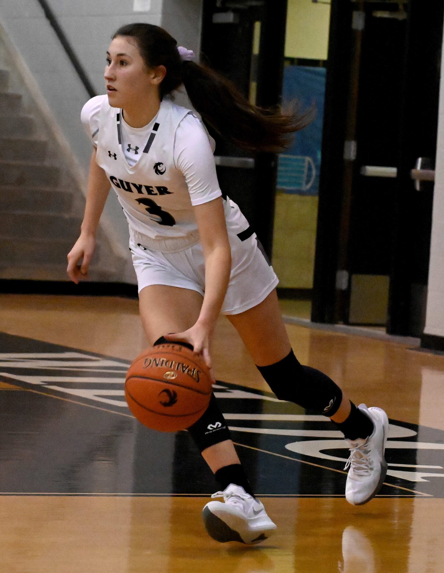 Denton Guyer’s Bella Earle brings the ball up court in the second half of a girls high...