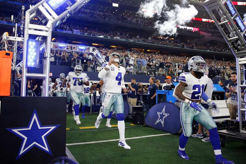 Dallas Cowboys quarterback Dak Prescott (4), Dallas Cowboys running back Ezekiel Elliott...