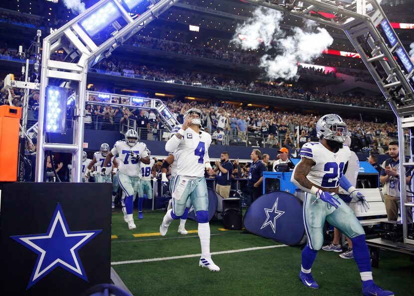 Dallas Cowboys quarterback Dak Prescott (4), Dallas Cowboys running back Ezekiel Elliott...