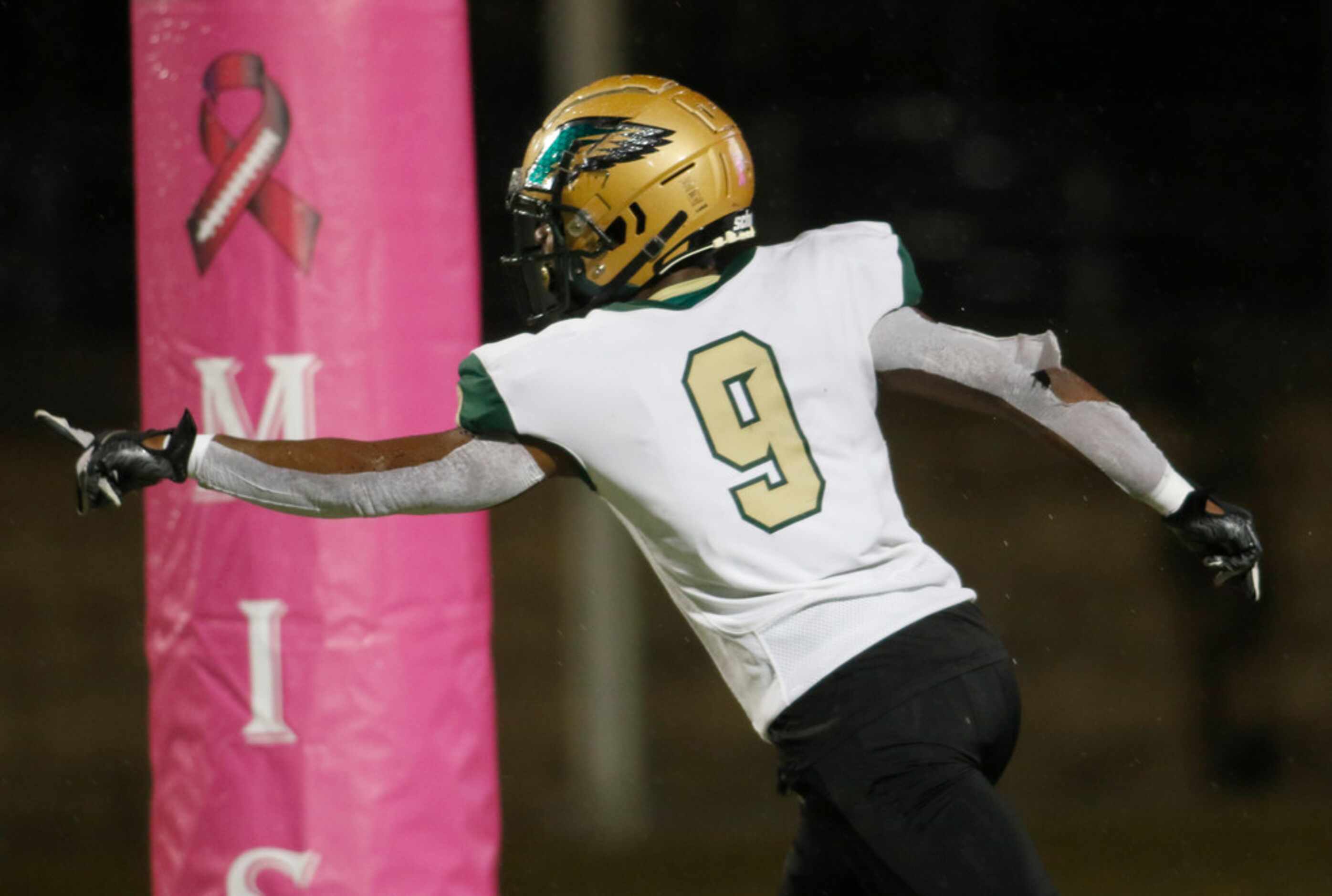 DeSoto Eagles linebacker Ridarius Branch (9) soars through the back of the end zone after...