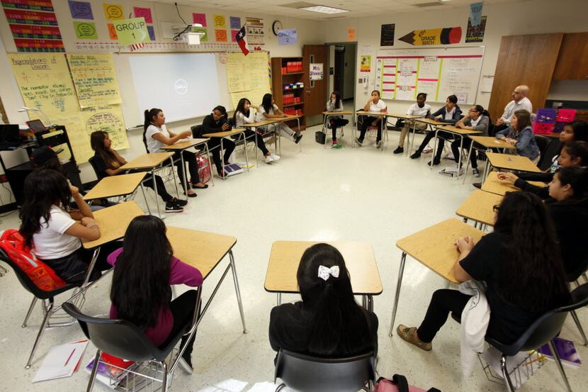 Students sit in a circle for an activity called restorative discipline, on Friday, Sept. 25,...