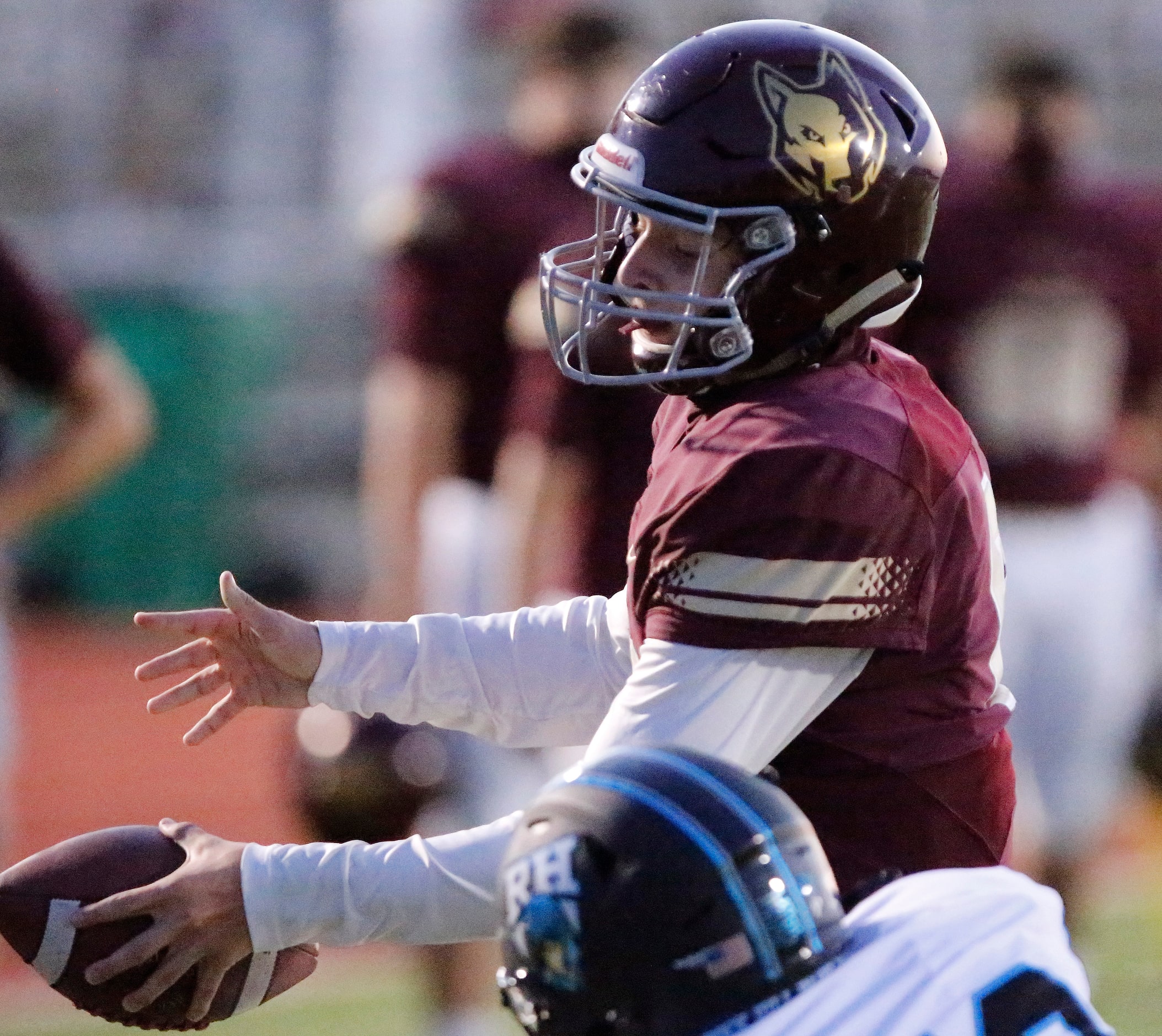 Heritage High School quarterback Easton Swetnam (6) scores a touchdown during the first...