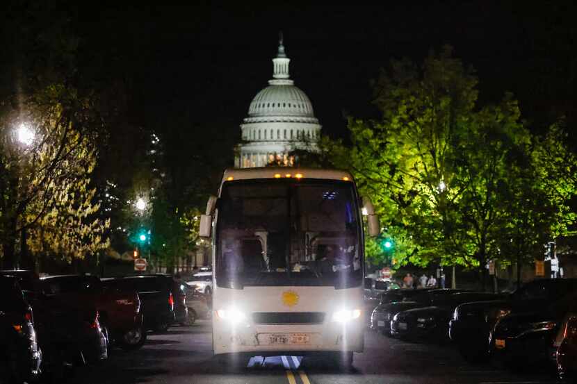A bus with migrants from Texas arrive in Washington, D.C. on Thursday, April 21, 2022, as...