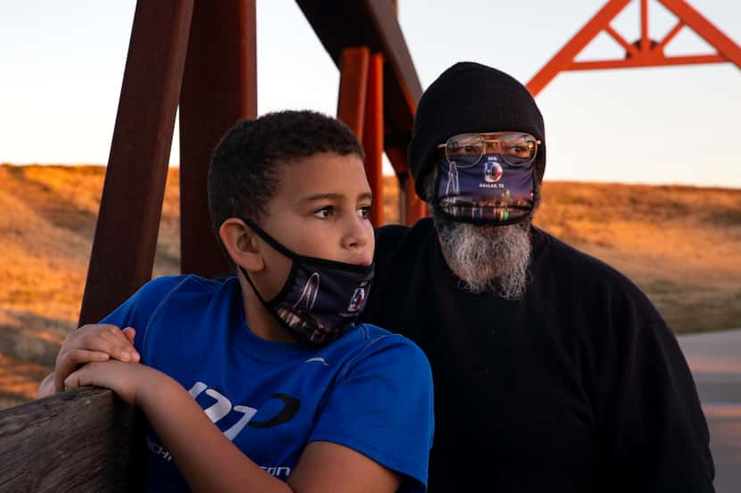 Randy and 11-year-old Jackson looked at the setting sun during a walk near Randy’s new...