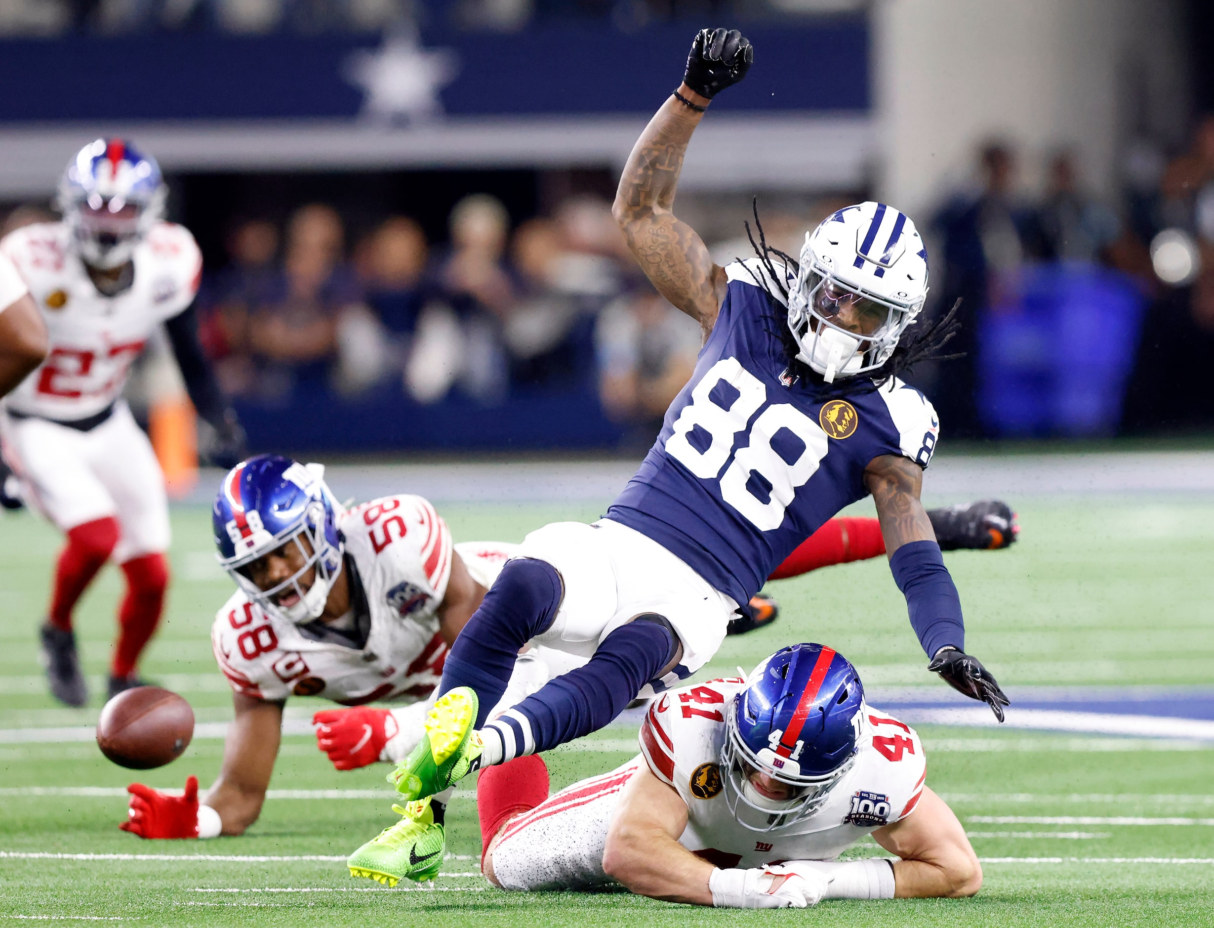 Dallas Cowboys wide receiver CeeDee Lamb (88) has his feet taken out from under him by New...