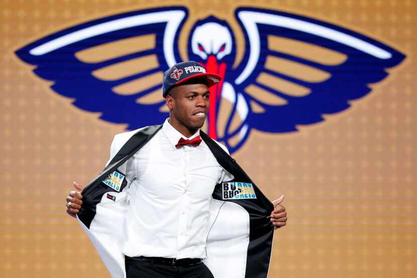 New Orleans Pelicans first-round draft pick Buddy Hield shows off his clothing during the...