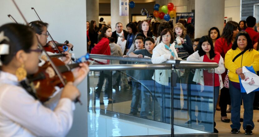 Parents and students at the open house listen to a Mariachi Band from the Grand Prairie Fine...