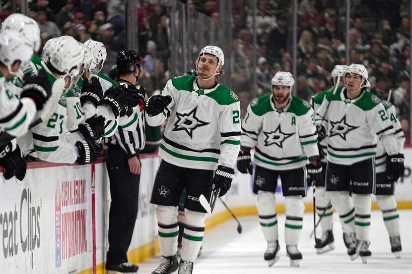 Dallas Stars center Roope Hintz, center, celebrates with teammates after scoring during the...