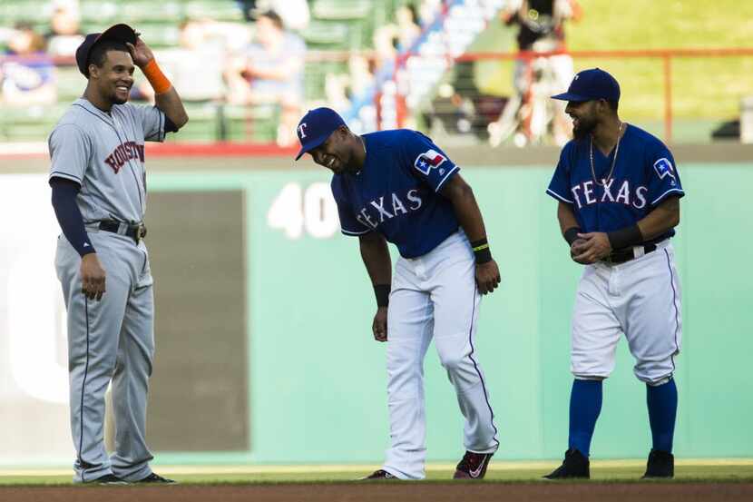 Texas Rangers shortstop Elvis Andrus (1) and second baseman Rougned Odor (12) share a laugh...