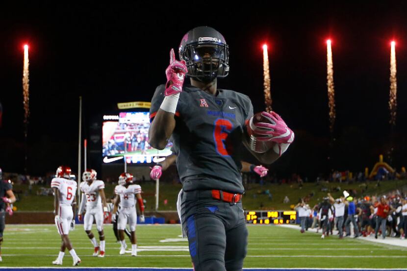 SMU running back Braeden West (6) scores the final touchdown as the fireworks go off at...