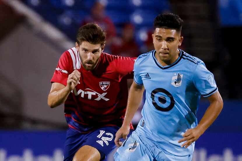 FC Dallas midfielder Ryan Hollingshead (12) chases after Minnesota United midfielder Emanuel...