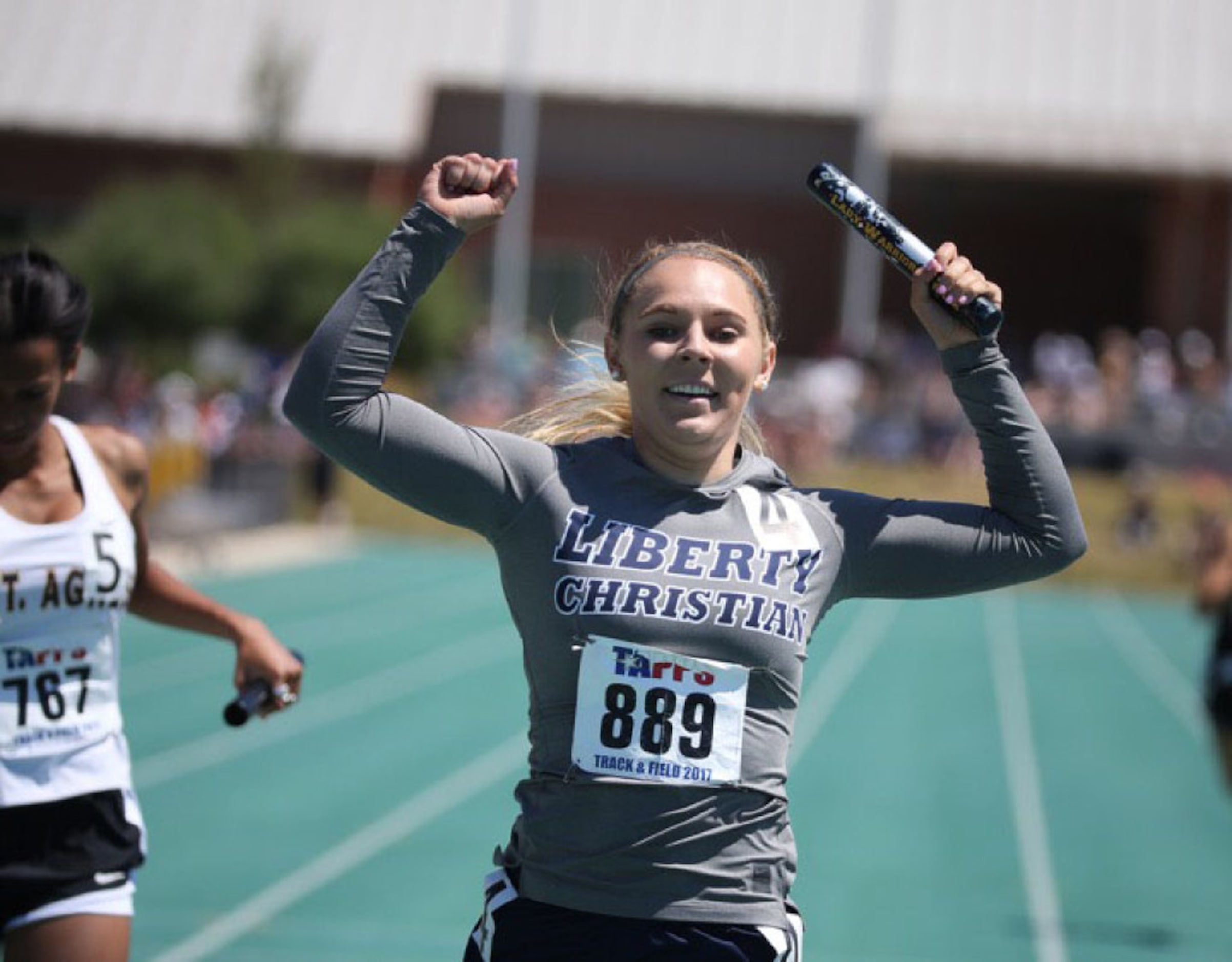 Liberty Christian Maddi Willet reacts to their first place win in the 6A women 4X200 relay...