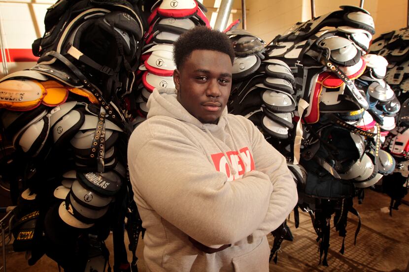South Grand Prairie nose tackle DeQuinton Osborne, pictured in the locker room at the high...