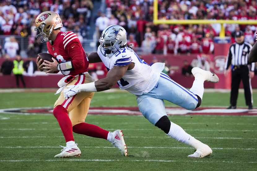 San Francisco 49ers quarterback Brock Purdy (13) is sacked by Dallas Cowboys defensive...