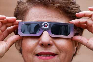 Solar eclipse enthusiast Leticia Ferrer poses wearing an eclipse glass, on Wednesday, Jan....