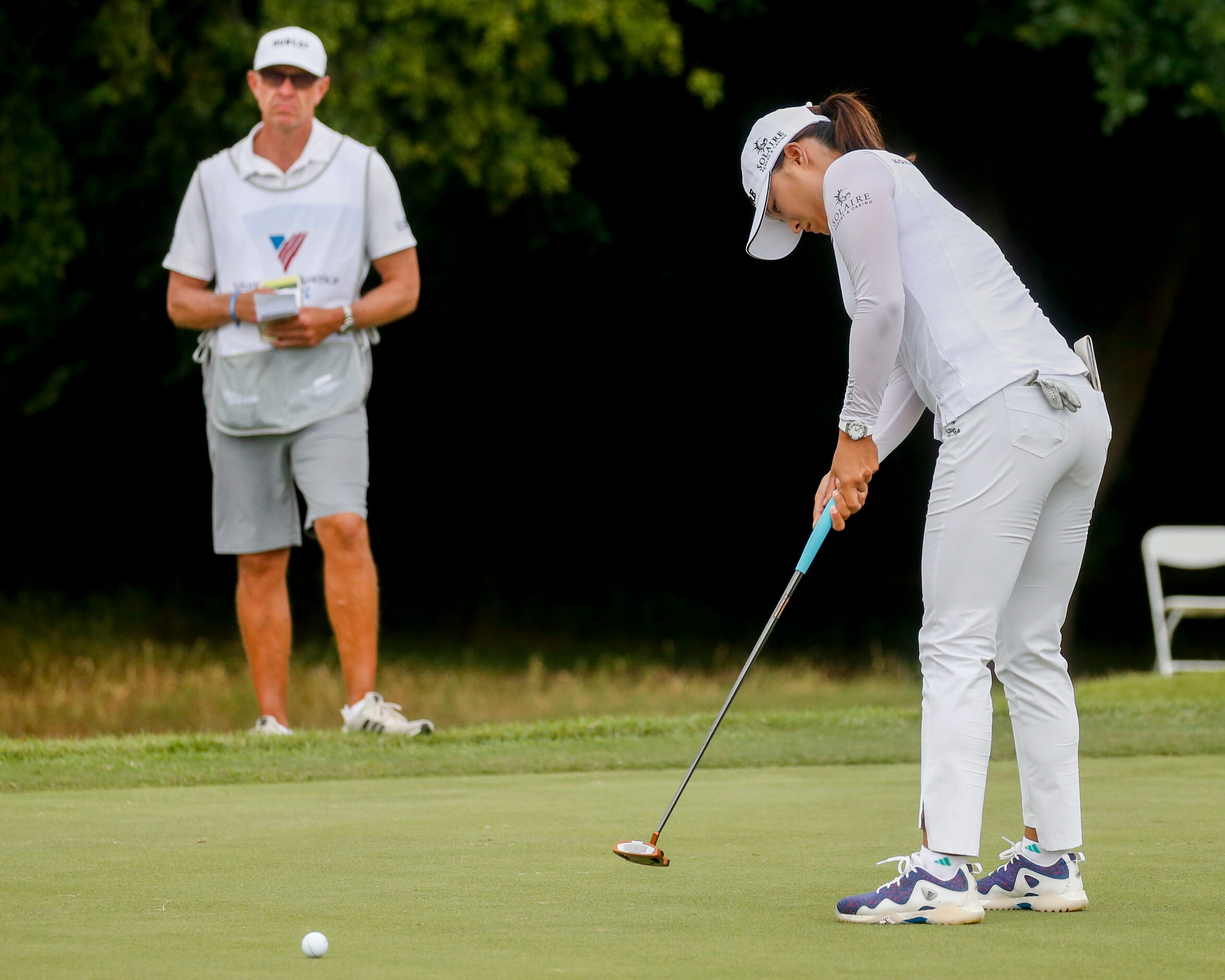 Professional golfer Jin Young Ko putts on the No. 12 green during the third round of the...