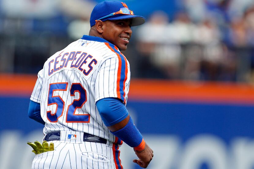 Yoenis Cespedes  of the New York Mets reacts after a catch during the first inning against...
