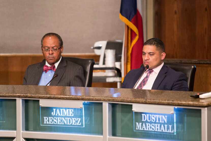 Trustees Lew Blackburn (left) and Jaime Resendez listen during a March 2017 at Dallas ISD...