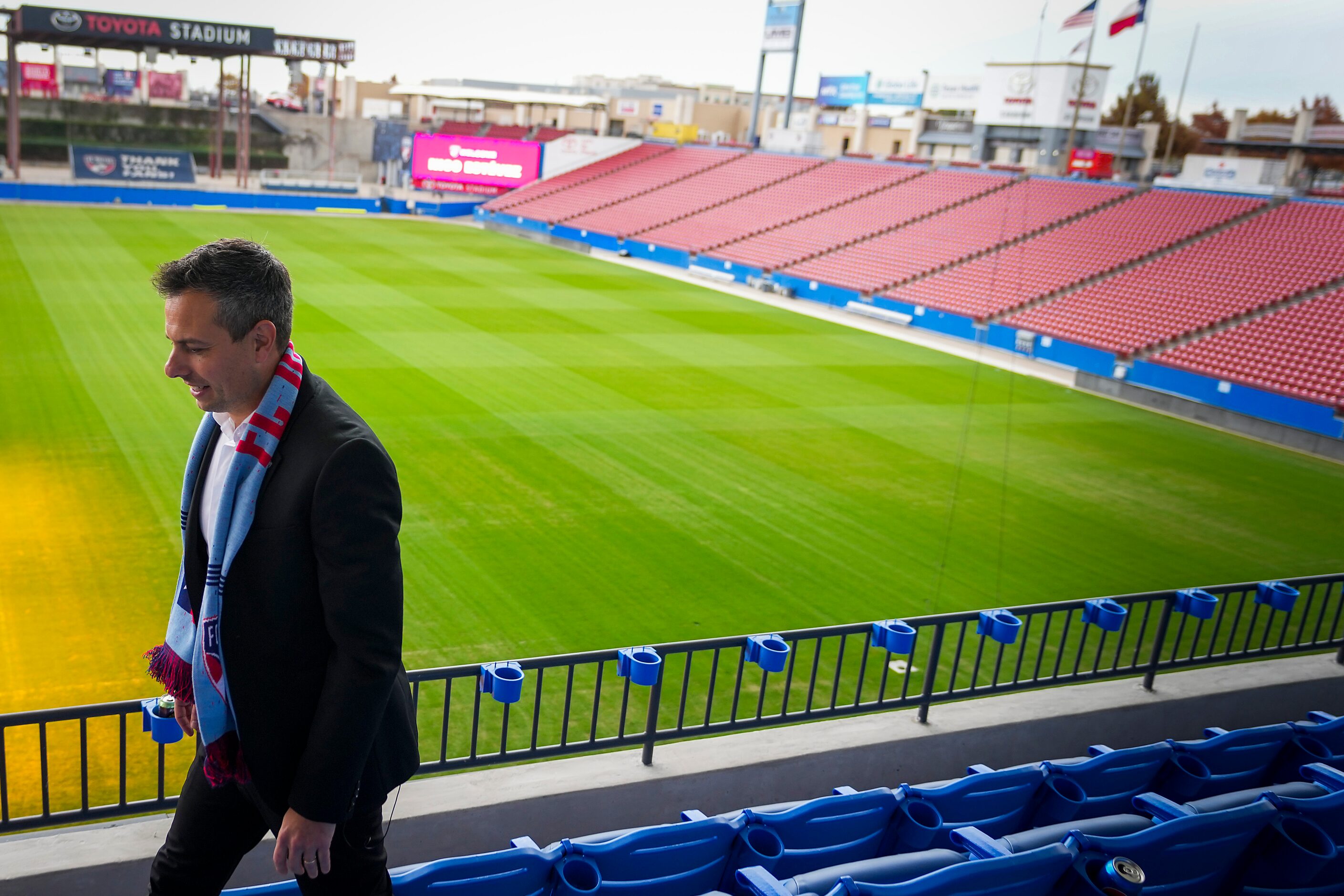 New FC Dallas head coach Nico Estévez walks through the stands at Toyota Stadium after his...