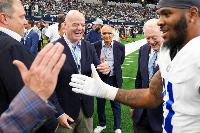 FIFA president Gianni Infantino gives a thumbs up to Dallas Cowboys linebacker Micah Parsons...