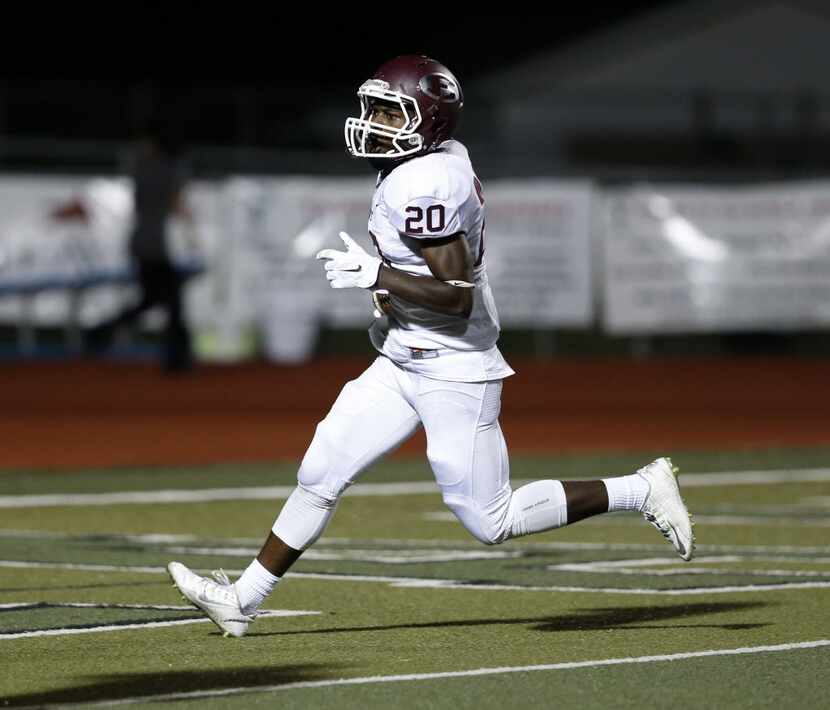 FILE - Ennis running back Tycen Thompson (20) makes a touchdown in the second half of the...