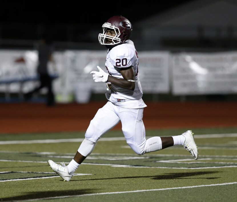 FILE - Ennis running back Tycen Thompson (20) makes a touchdown in the second half of the...