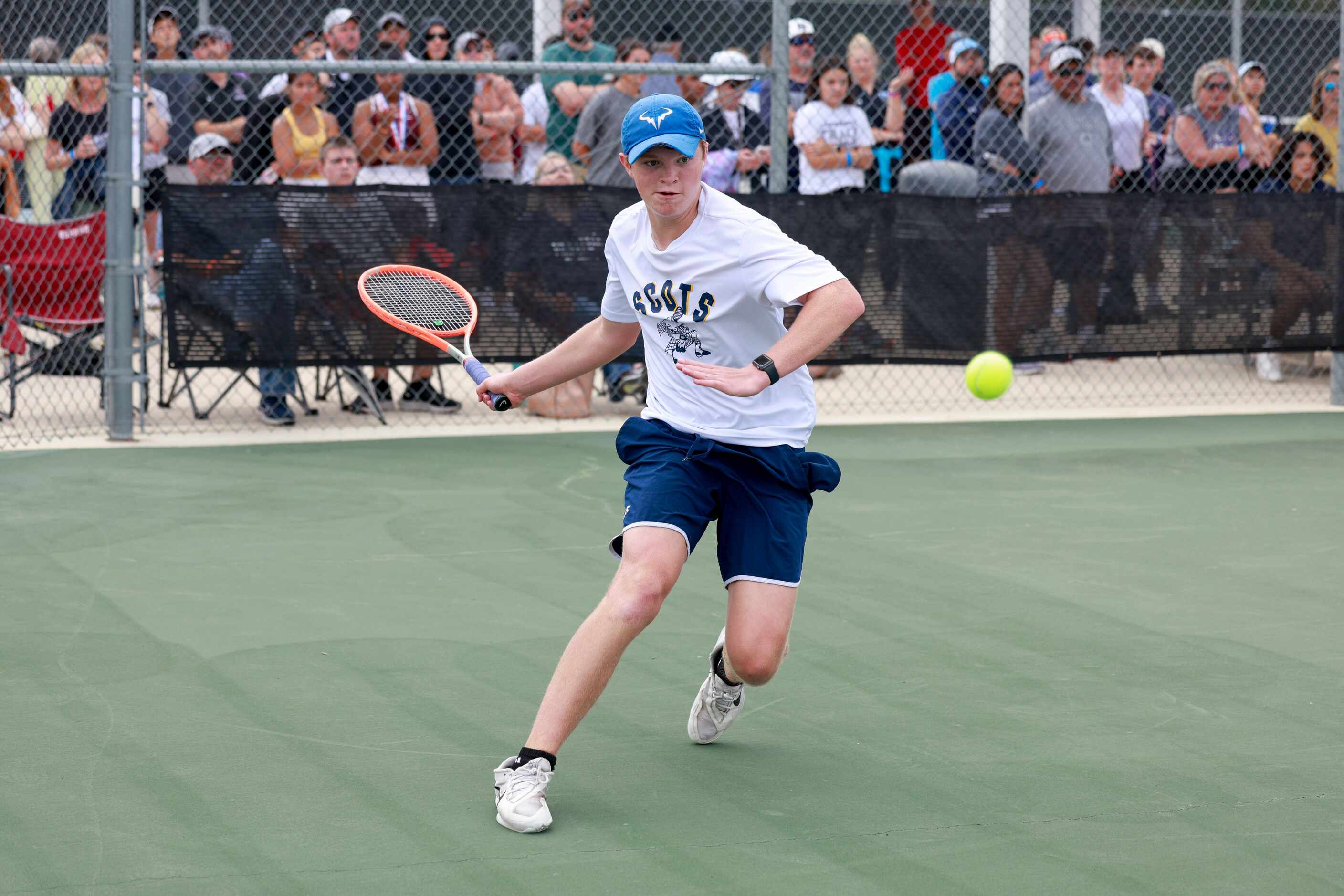 Highland Park’s Carl Newell runs to hit a return during the 5A boys doubles championship...