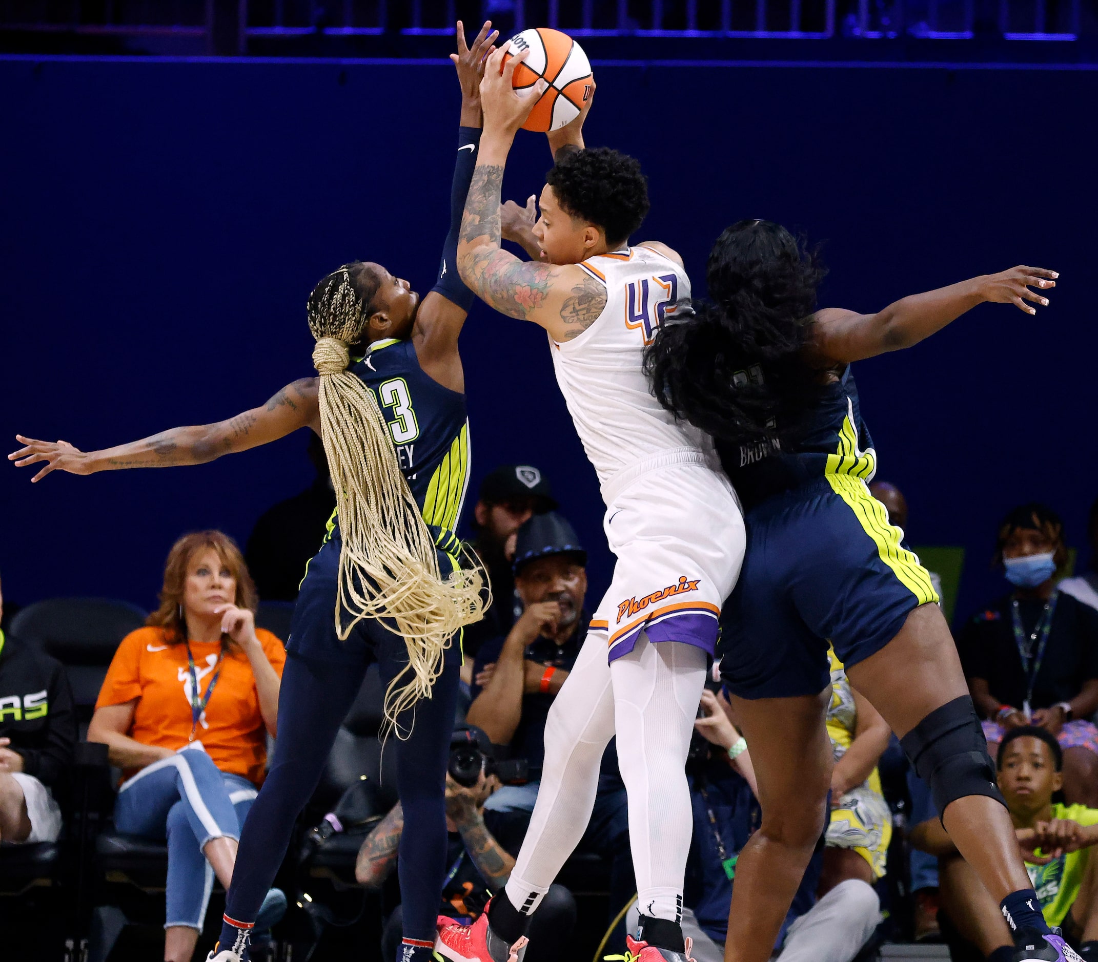 Phoenix Mercury center Brittney Griner (42) pulls down a rebound against Dallas Wings center...