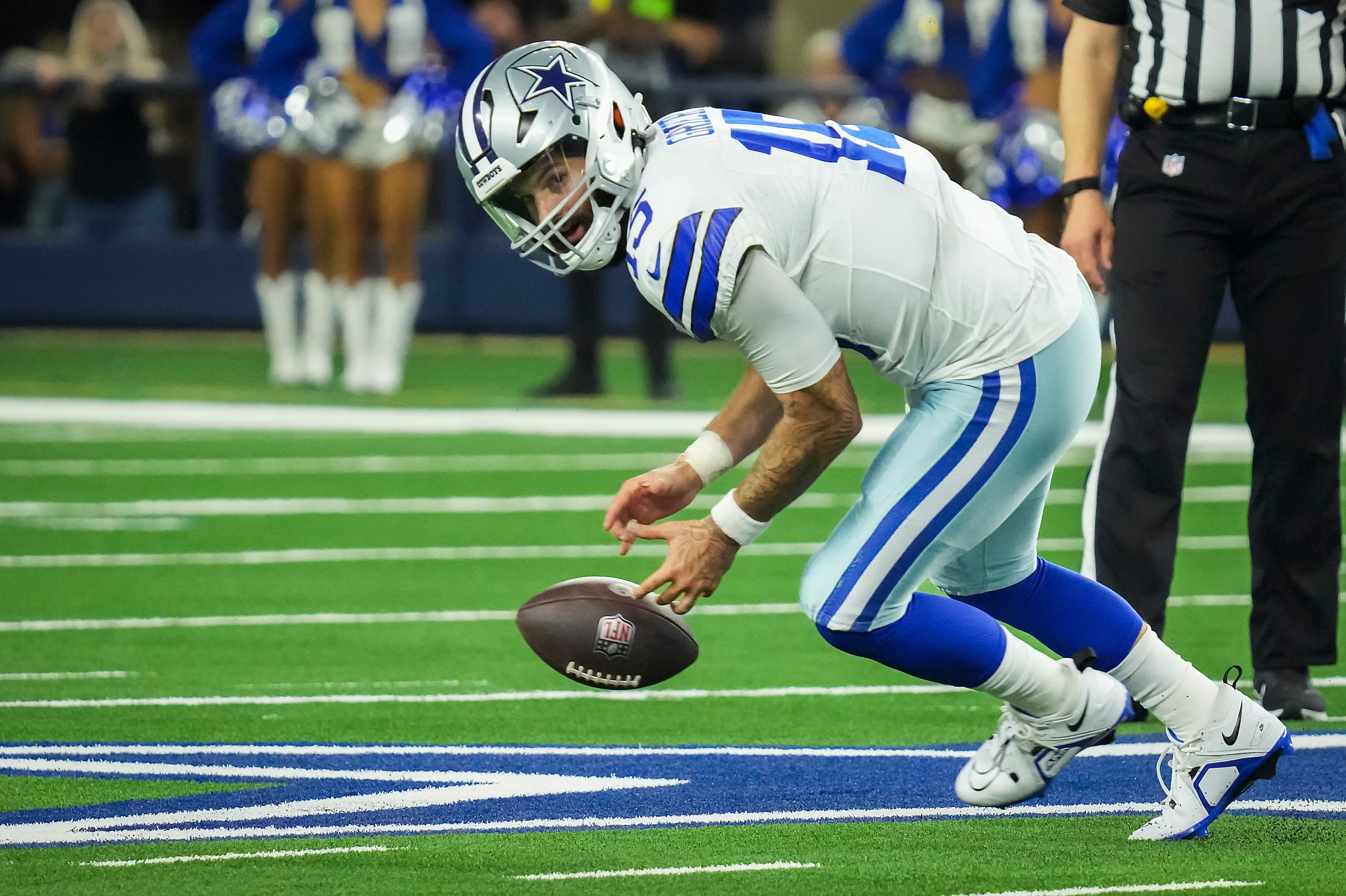 Dallas Cowboys quarterback Will Grier (15) recovers a fumbles snap during the second half of...