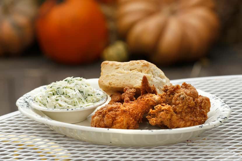 Fried chicken served with a biscuit and cole slaw at Whistle Britches.