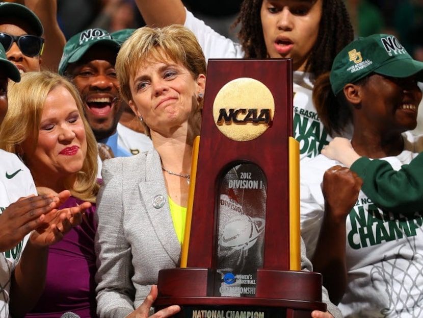 Head coach Kim Mulkey and Brittney Griner #42 of the Baylor Bears celebrate with the...