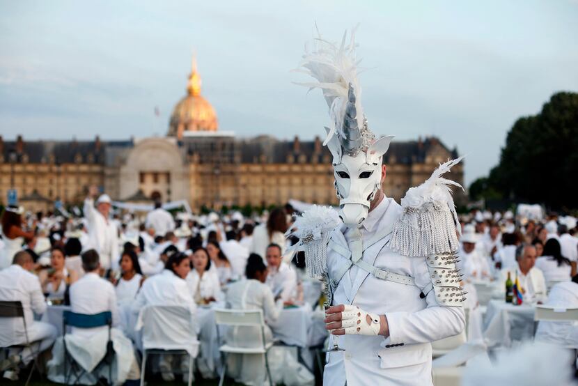 Guests to Diner en Blanc are asked to bring their own tables and chairs, then line them up...