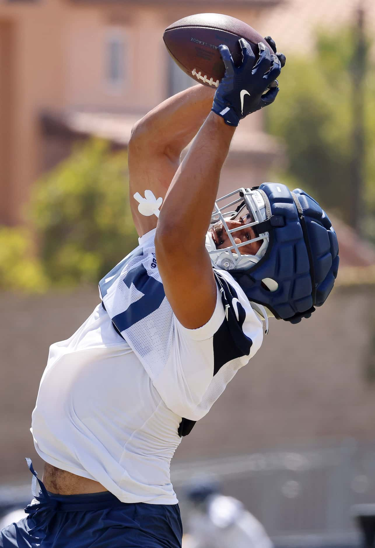 Dallas Cowboys tight end Brevyn Spann-Ford (47) reaches for a pass during a training camp...