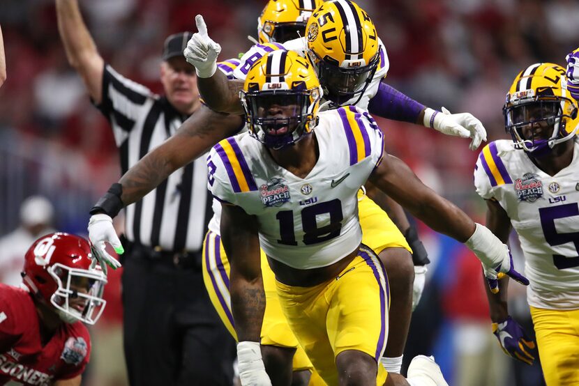 ATLANTA, GEORGIA - DECEMBER 28: Linebacker K'Lavon Chaisson #18 of the LSU Tigers and...