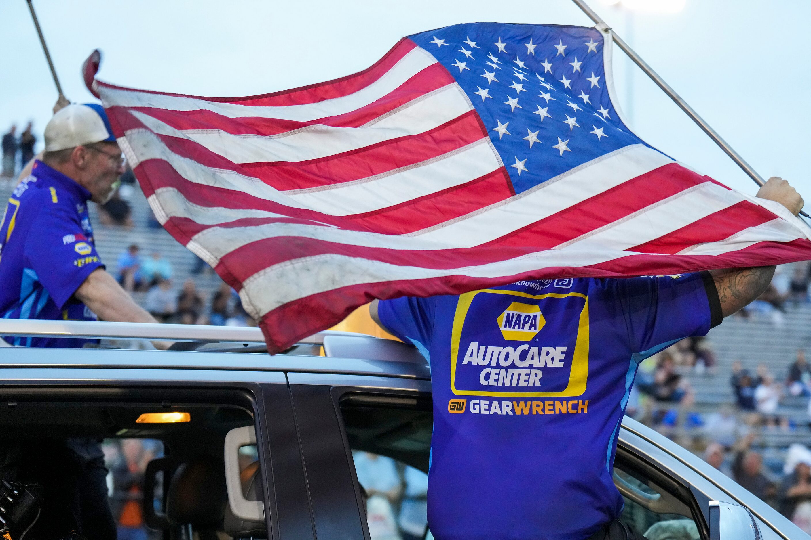 Ron Capps’ crew celebrates his Funny Car finals victory over Matt Hagan at the Texas NHRA...