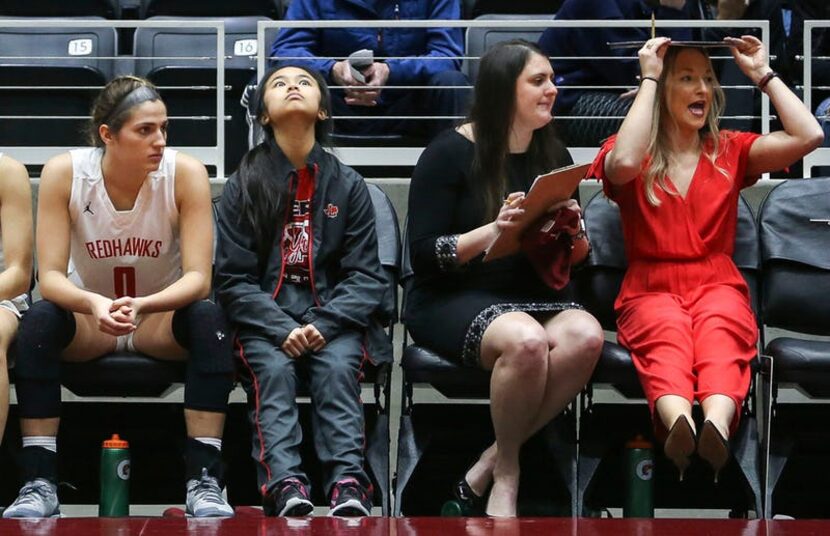 The Frisco Liberty bench reacts to a play during the second half of a girls basketball Class...