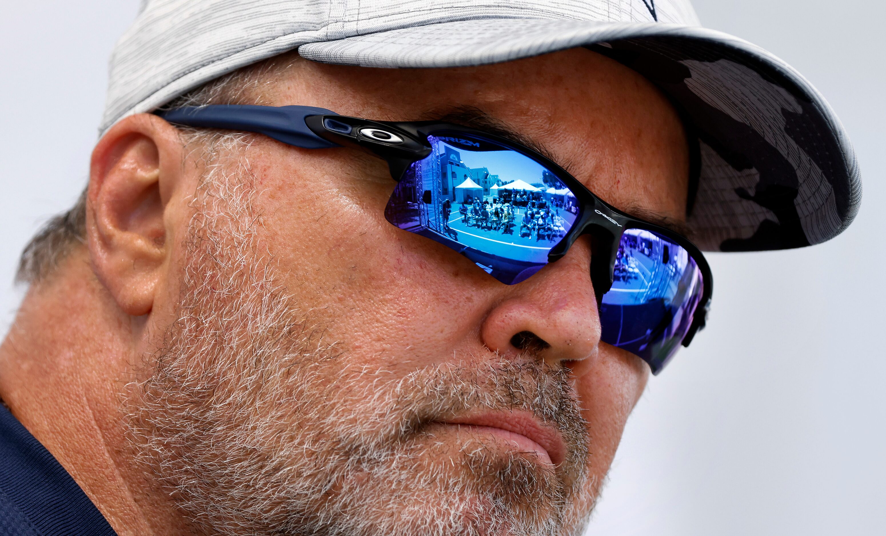 The media are reflected in Dallas Cowboys head coach Mike McCarthy’s sunglasses as he...