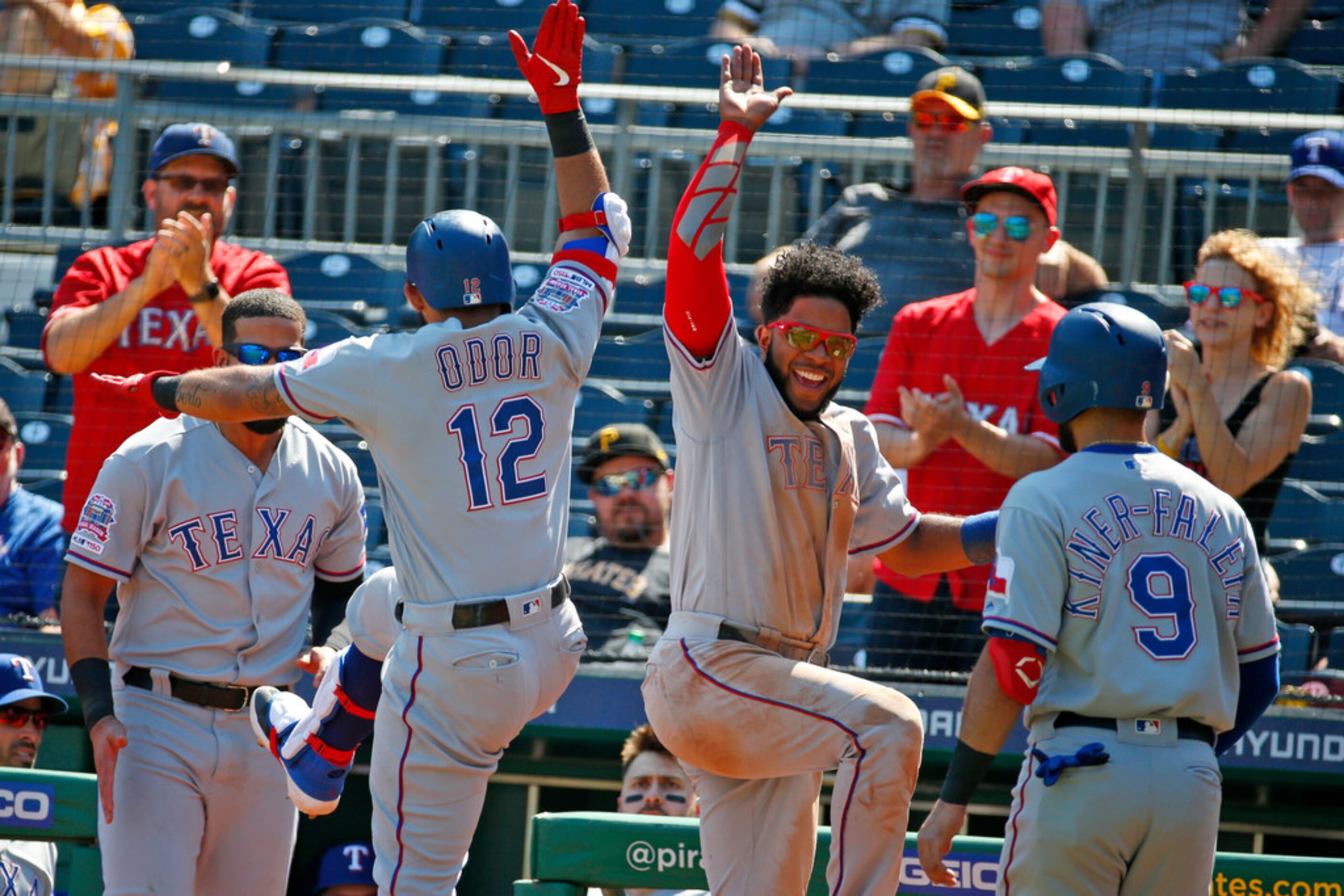 PITTSBURGH, PA - MAY 08:  Rougned Odor #12 of the Texas Rangers celebrates with Elvis Andrus...