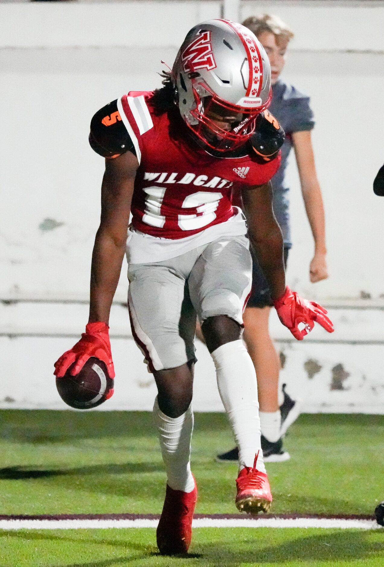 Woodrow Wilson junior wide receiver Cyris Taylor (13) celebrates scoring a touchdown during...