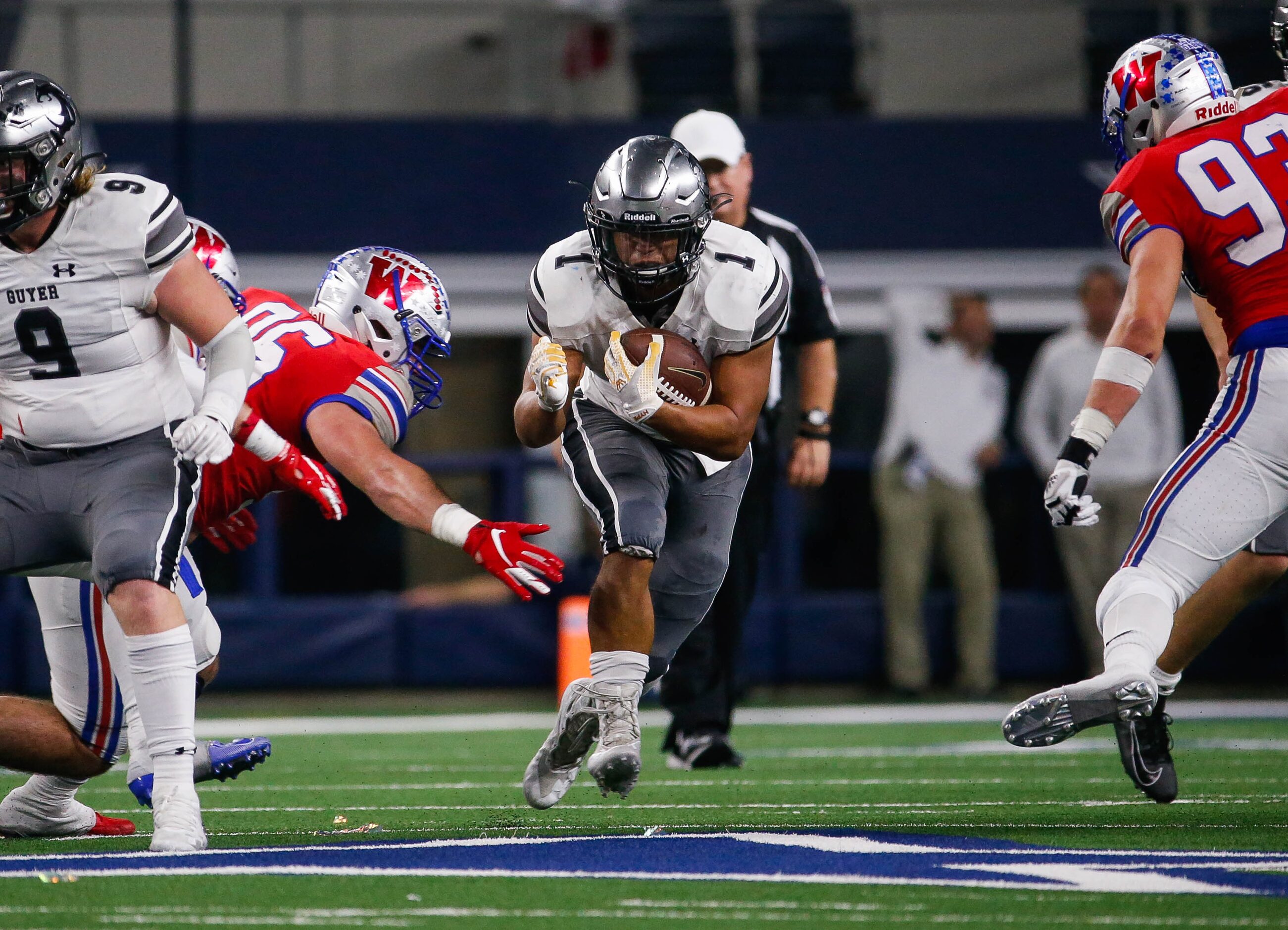 Denton Guyer's RB Kaedric Cobbs (1) tries to get past Westlake's defense in the second...