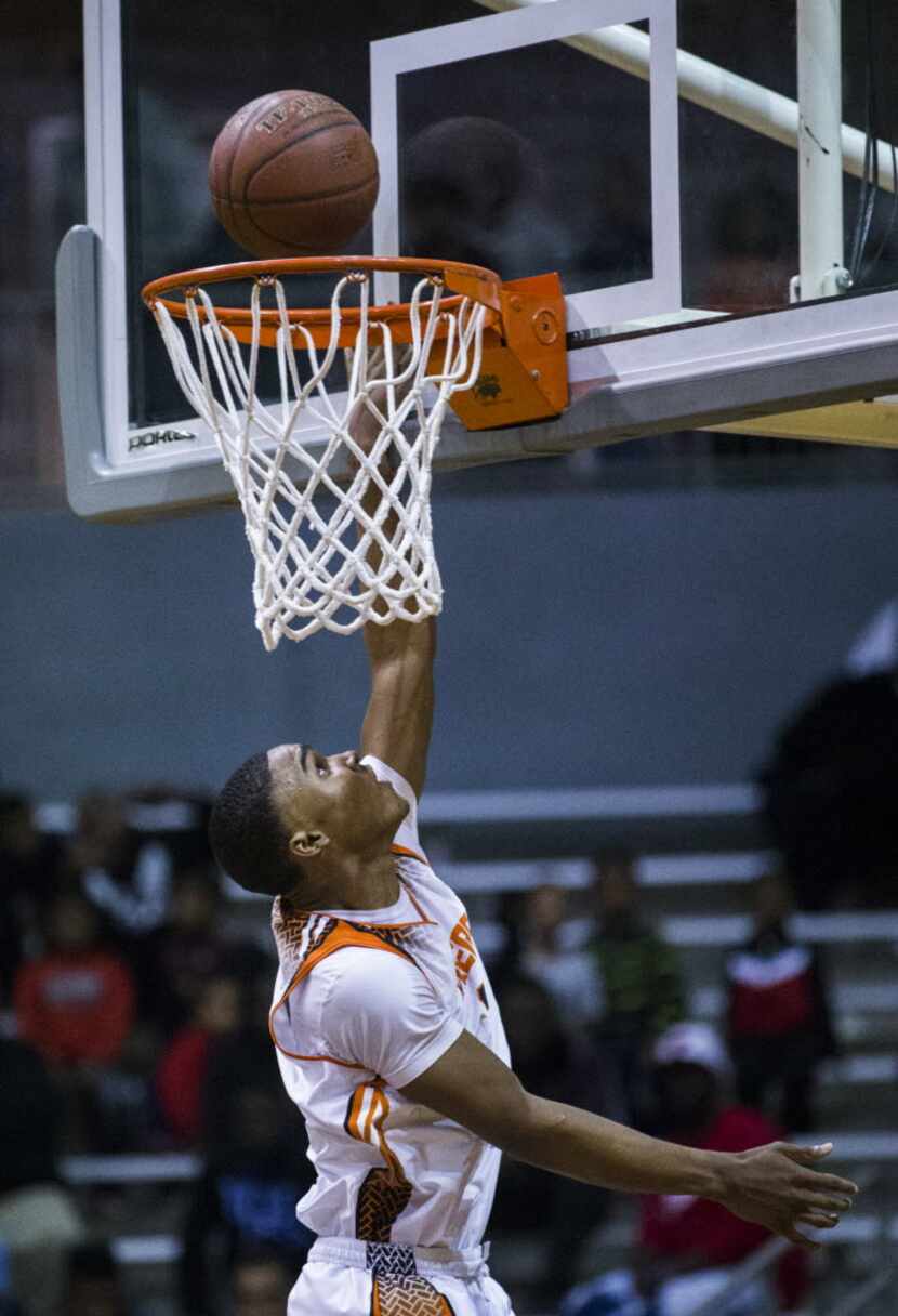 Lancaster's T.J. Starks (3) goes up for a layup during the fourth quarter of their Dallas...