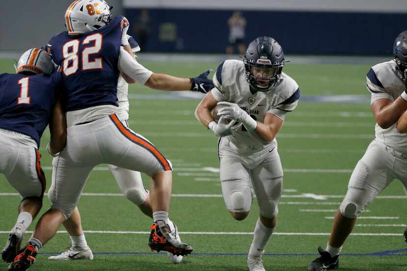 Frisco Lone Star's Jake Bogdon (2) scores a touchdown as Frisco Wakeland's Preston Snean...