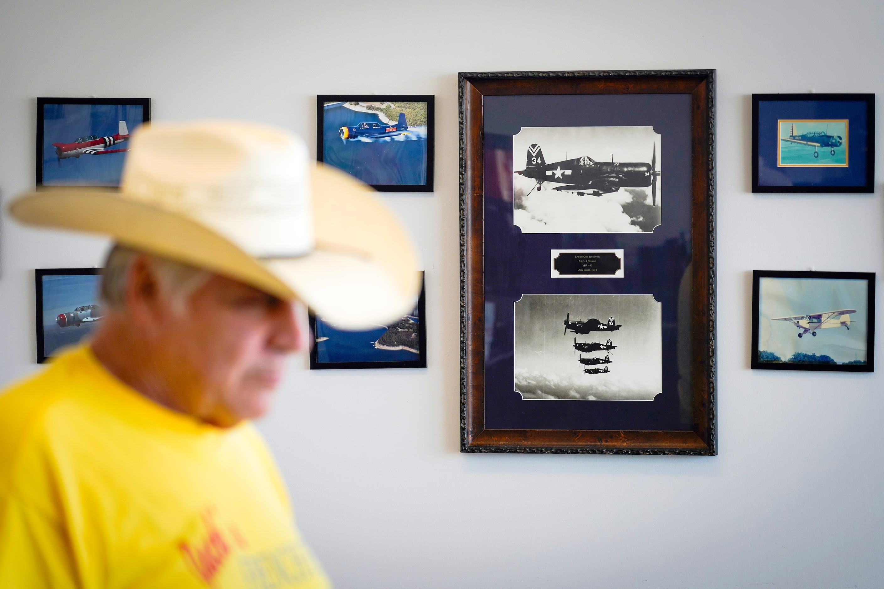 Images of aircraft line the walls behind Jack Pyland at Jack's Airport Cafe in Lancaster. 