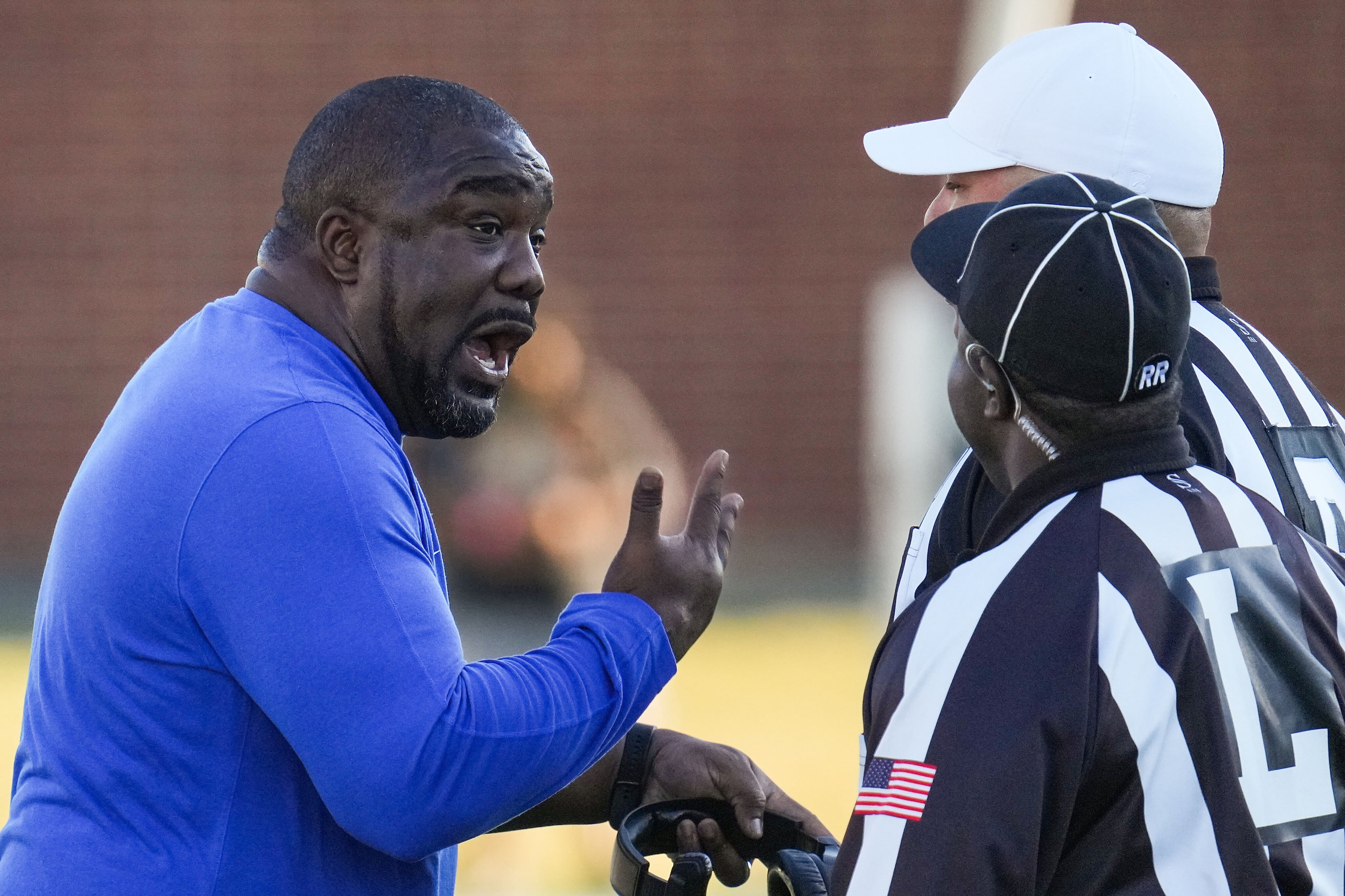 North Crowley head coach Ray Gates talks with officials during the second half of a UIL...