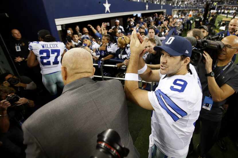 Dallas Cowboys quarterback Tony Romo (9) is all smiles after defeating the Detroit Lions in...