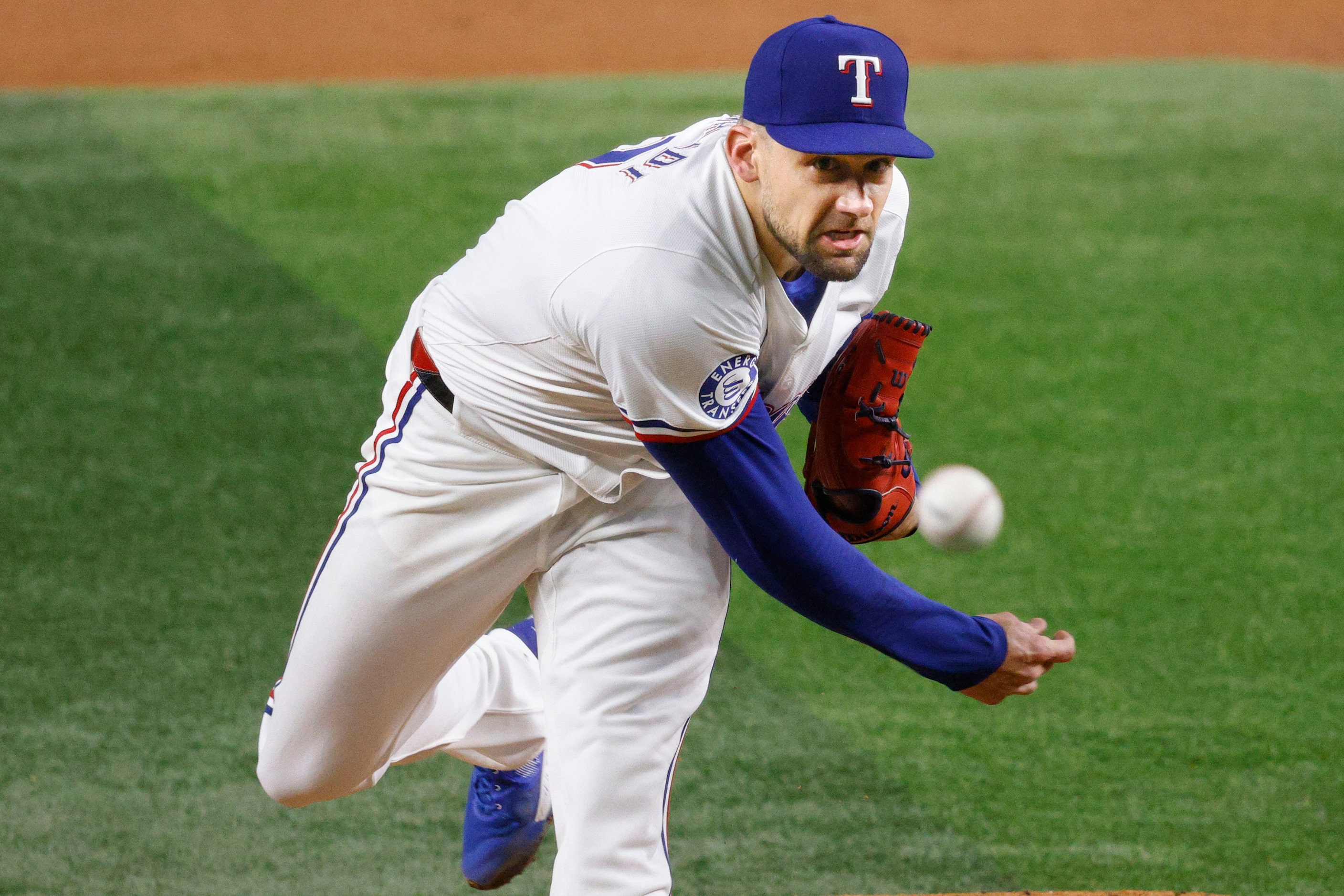 Texas Rangers pitcher Nathan Eovaldi (17) delivers during the second inning of a baseball...