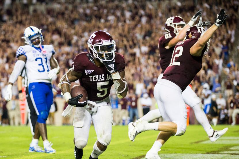 Texas A&M Aggies running back Trayveon Williams (5) lands in the end zone for the game...