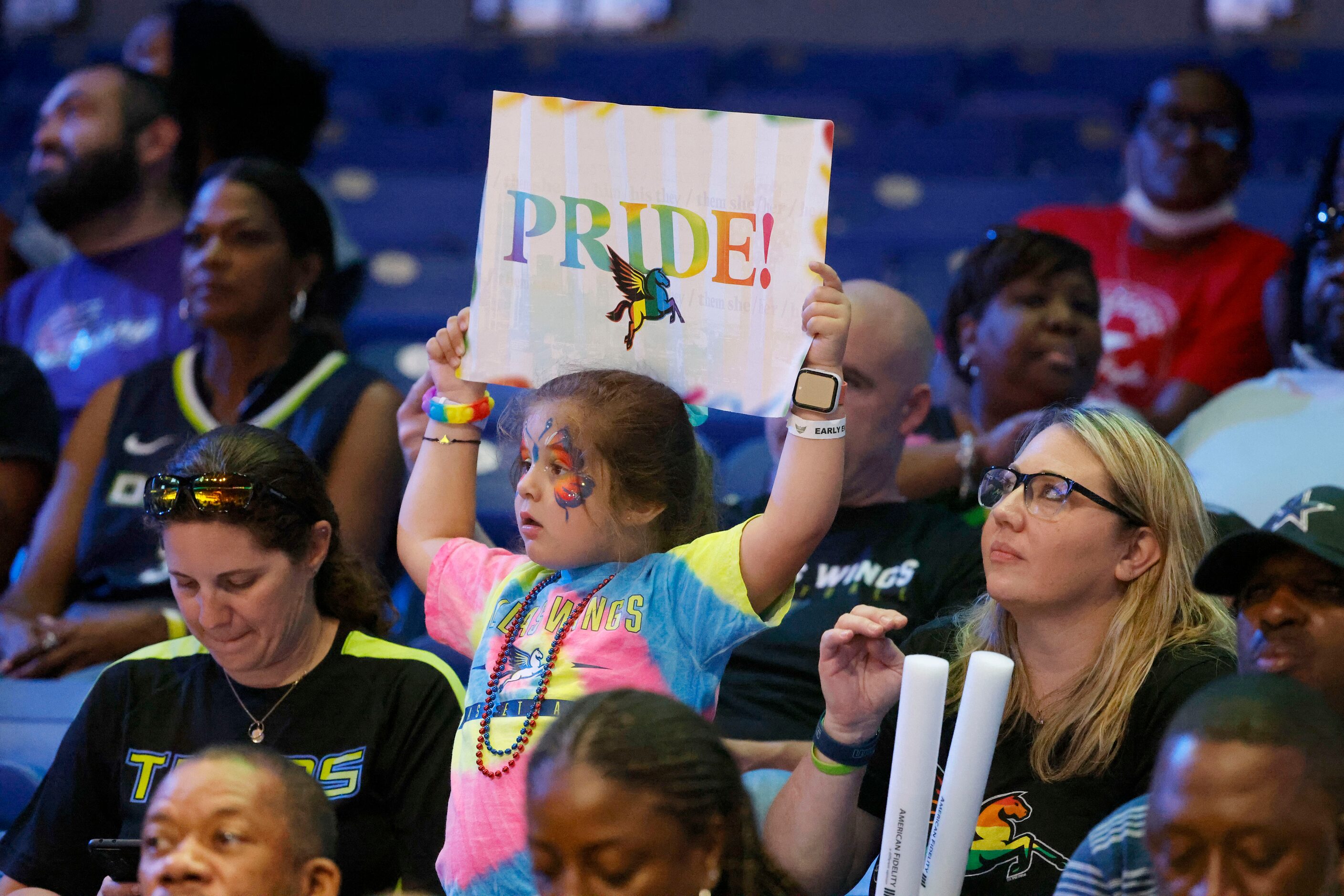 Fans cheer during Pride Night at the Dallas Wings-Phoenix Mercury WNBA basketball game in...