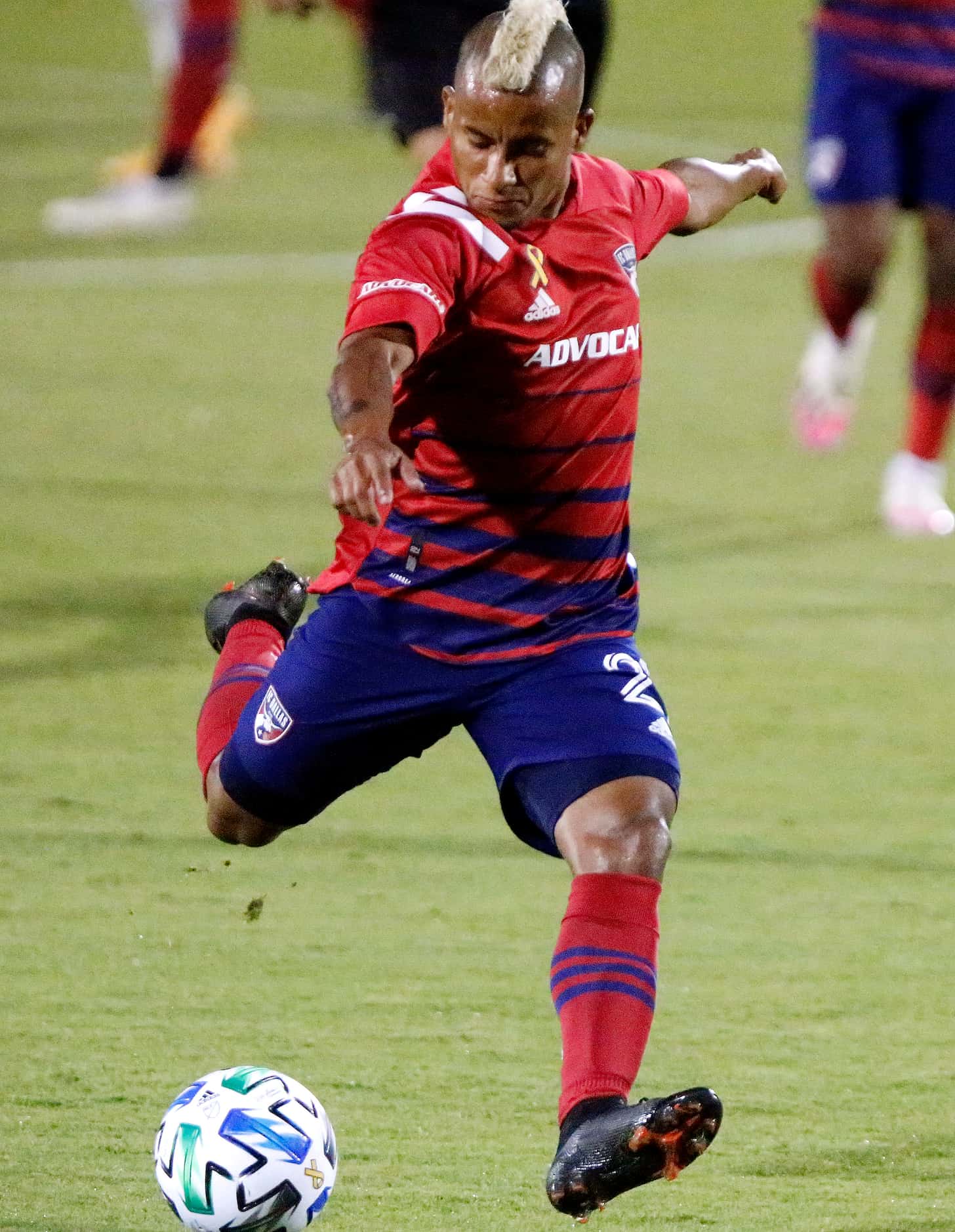 FC Dallas midfielder Michael Barrios (21) takes a shot on goal during the first half as FC...